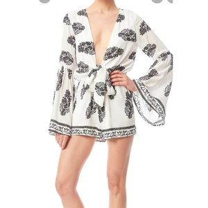 Love Riche white and black long sleeve romper with flared sleeves. Size S.
